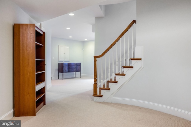 staircase with recessed lighting, baseboards, and carpet floors