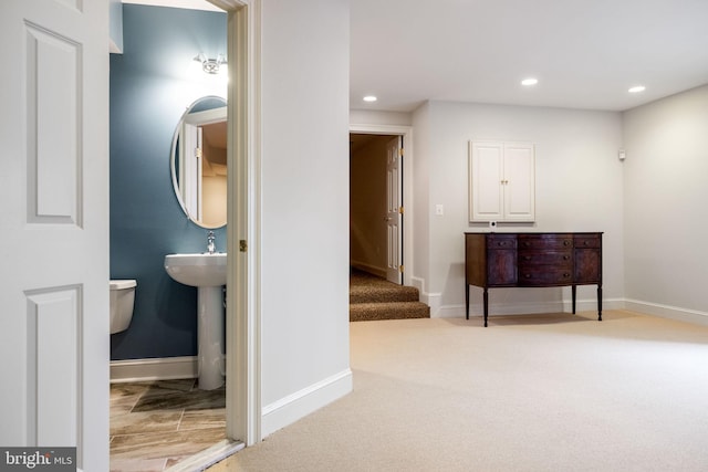 corridor featuring recessed lighting, baseboards, and carpet floors