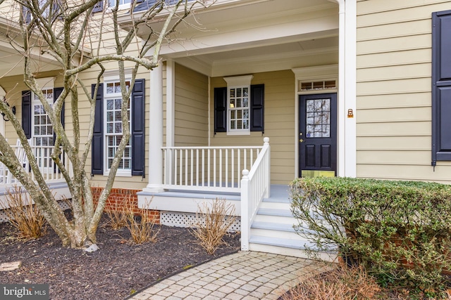 property entrance featuring a porch