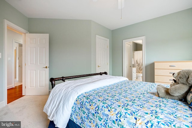 bedroom featuring carpet floors and connected bathroom