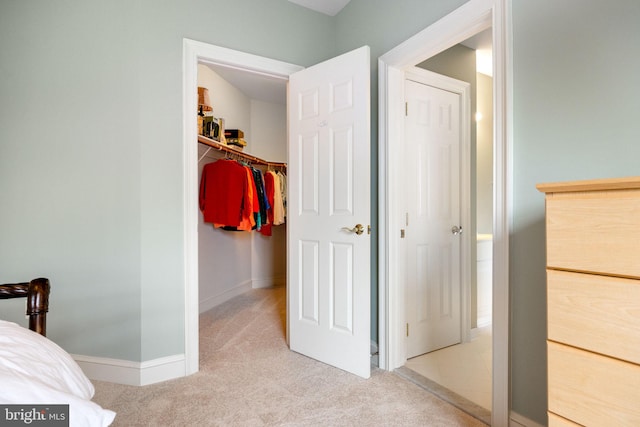 carpeted bedroom with baseboards