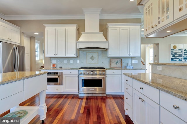 24537 Wave Maker Dr, Millsboro, DE 19966 - kitchen featuring white cabinetry, custom range hood, ornamental molding, and stainless steel appliances