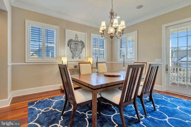 24537 Wave Maker Dr, Millsboro, DE 19966 - dining area featuring plenty of natural light, an inviting chandelier, wood finished floors, and crown molding