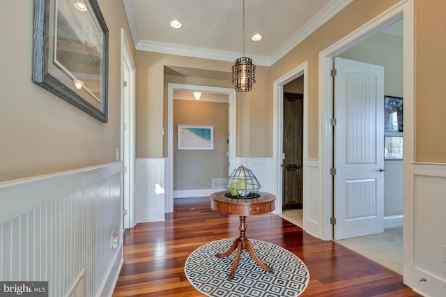 24537 Wave Maker Dr, Millsboro, DE 19966 - hall featuring visible vents, ornamental molding, wainscoting, an inviting chandelier, and wood finished floors