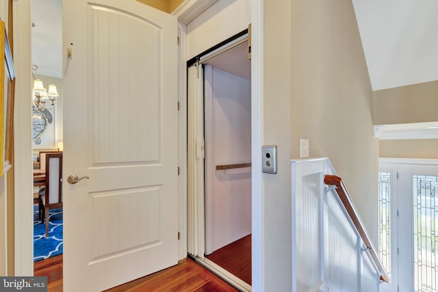 24537 Wave Maker Dr, Millsboro, DE 19966 - hall with a chandelier, an upstairs landing, and wood finished floors