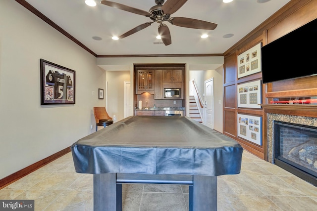 24537 Wave Maker Dr, Millsboro, DE 19966 - rec room featuring baseboards, ornamental molding, a glass covered fireplace, billiards, and a ceiling fan