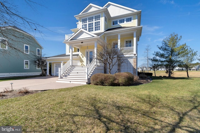 24537 Wave Maker Dr, Millsboro, DE 19966 - view of front of house with stairway, a porch, concrete driveway, and a front lawn