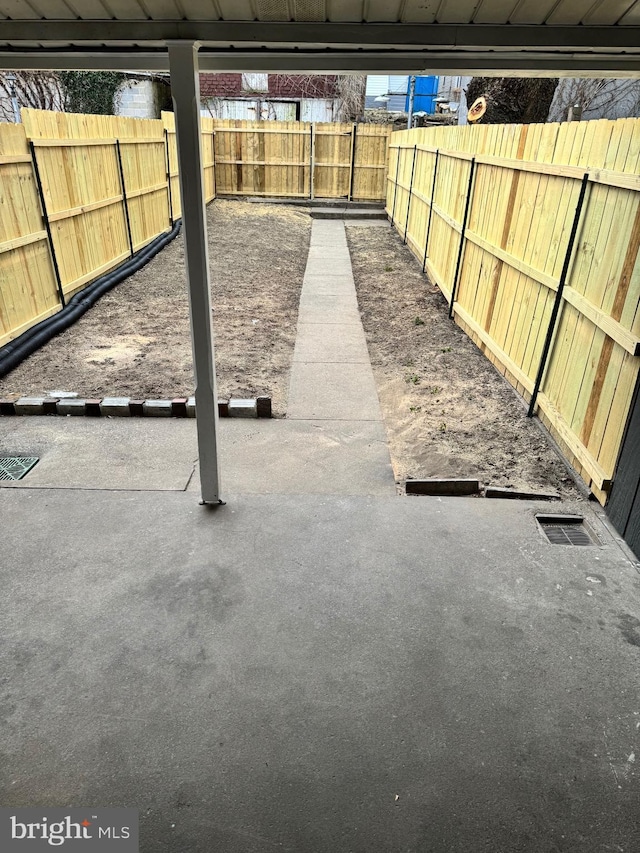 view of patio / terrace featuring fence and visible vents