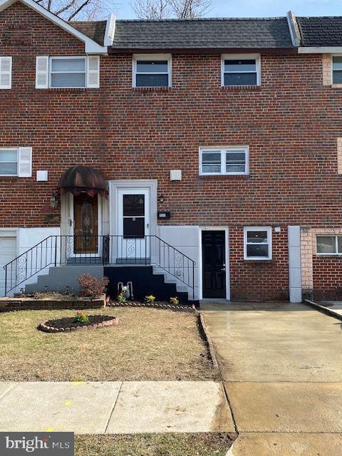 multi unit property featuring brick siding and roof with shingles