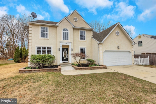 view of front of property featuring stucco siding, fence, concrete driveway, an attached garage, and a front yard