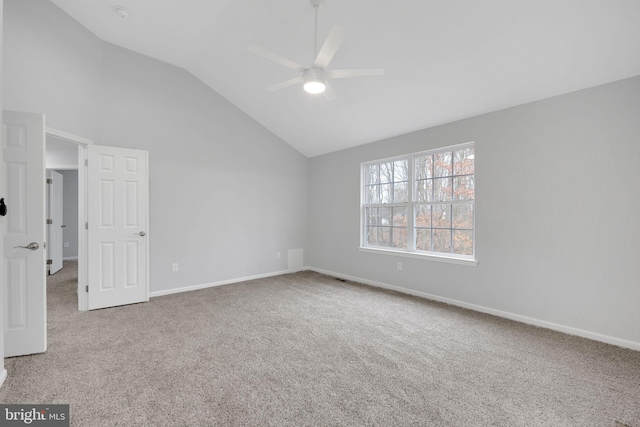 unfurnished bedroom featuring vaulted ceiling, baseboards, carpet floors, and ceiling fan