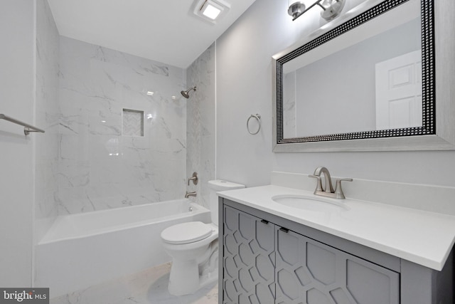 full bathroom with toilet, marble finish floor, vanity, and shower / tub combination