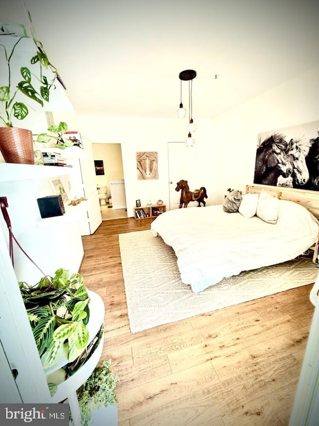 bedroom with light wood-style flooring