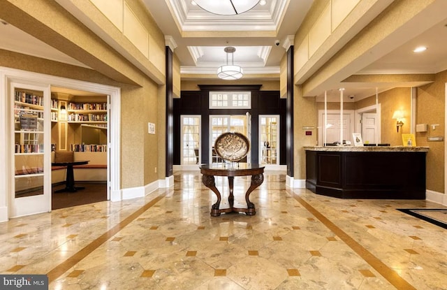 foyer entrance with crown molding, baseboards, recessed lighting, marble finish floor, and a raised ceiling