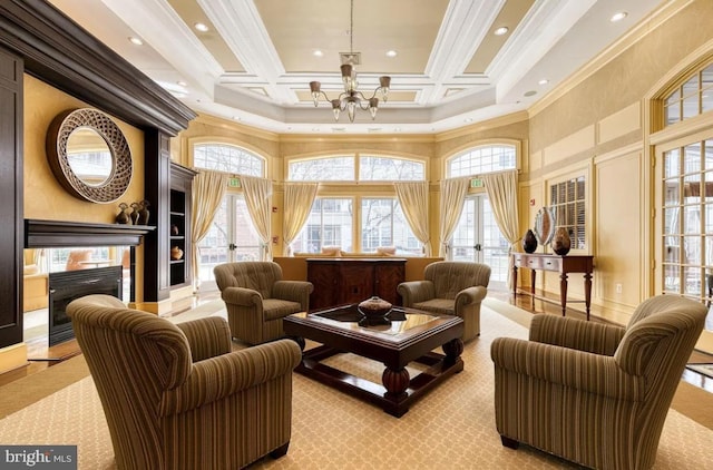 living room featuring recessed lighting, a high ceiling, an inviting chandelier, and ornamental molding