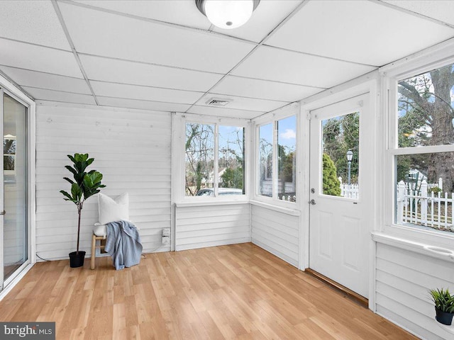 unfurnished sunroom featuring visible vents and a paneled ceiling