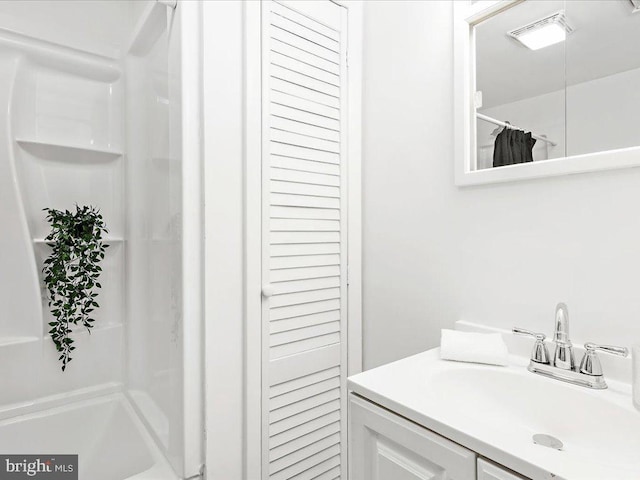 bathroom with vanity and a shower with shower curtain