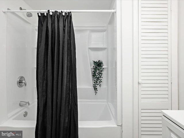 bathroom featuring vanity and shower / tub combo