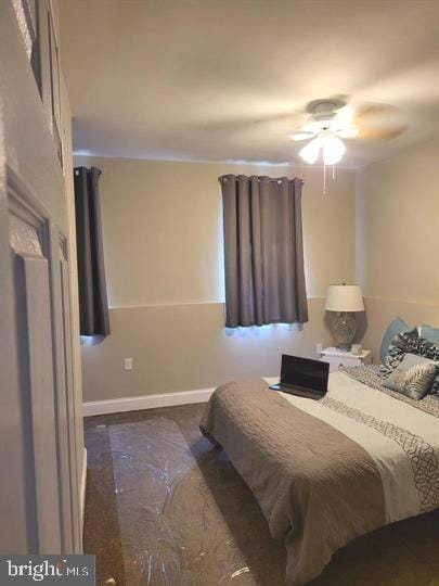 bedroom with baseboards and ceiling fan