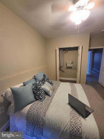 bedroom with a closet and a ceiling fan