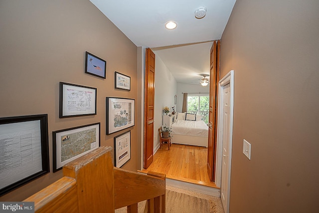 corridor featuring light wood-style flooring