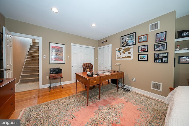 office area featuring recessed lighting, light wood-type flooring, baseboards, and visible vents