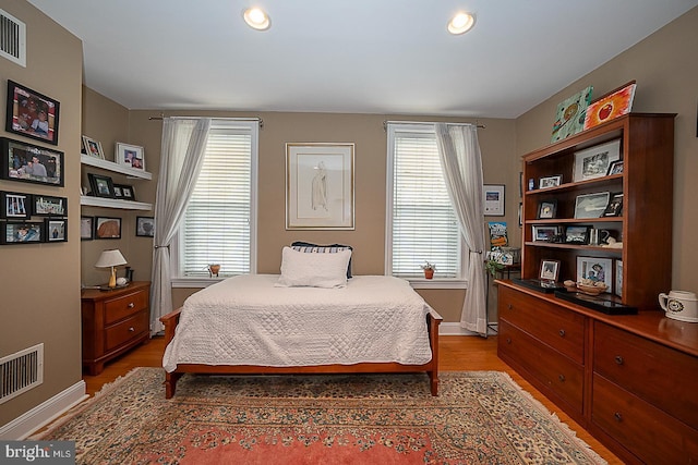 bedroom featuring visible vents, recessed lighting, and light wood-type flooring