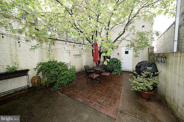 view of patio / terrace featuring fence