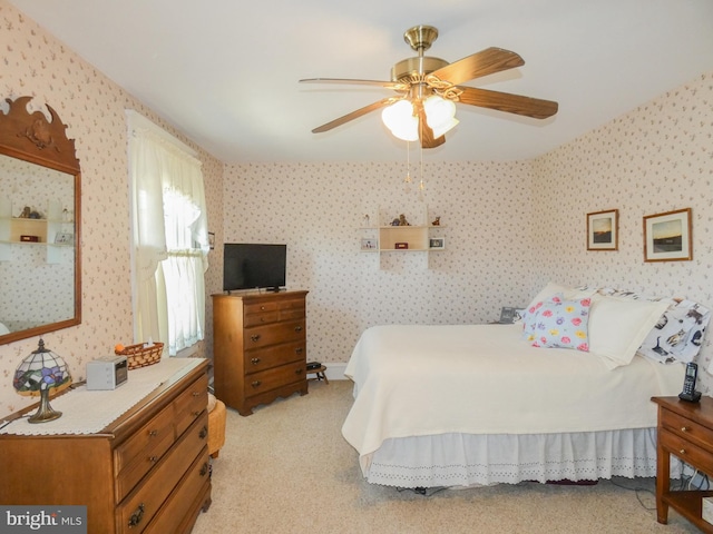 bedroom featuring wallpapered walls and light carpet