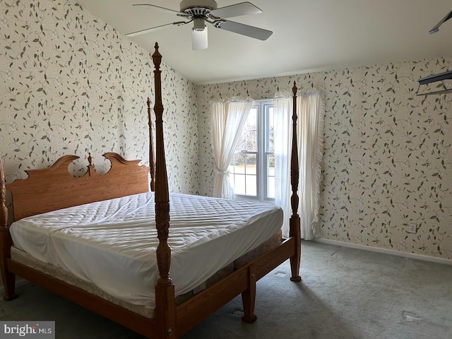 bedroom featuring baseboards, wallpapered walls, a ceiling fan, and carpet floors