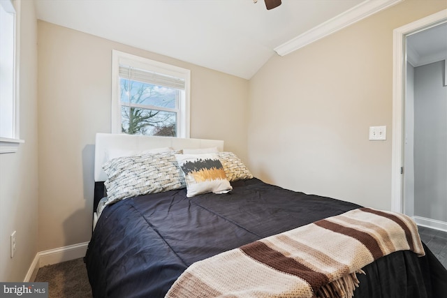 bedroom with ornamental molding, a ceiling fan, baseboards, and vaulted ceiling