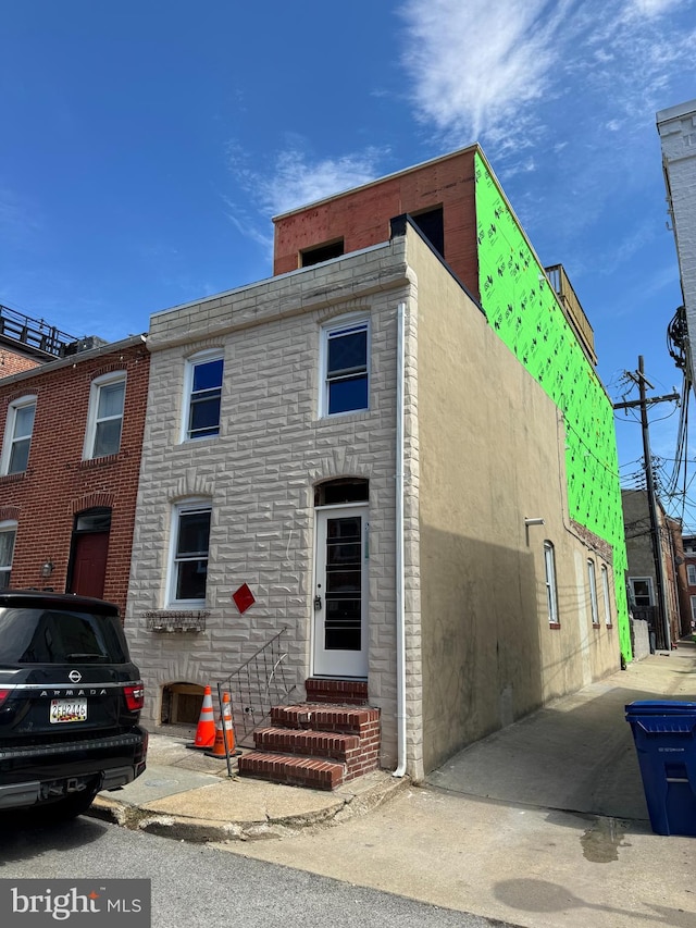 1029 S Curley St, Baltimore, MD 21224 - view of front of home featuring entry steps and stucco siding