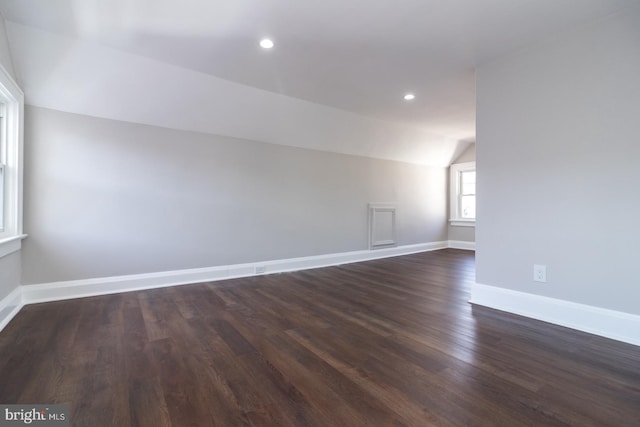 bonus room with dark wood-style flooring, recessed lighting, baseboards, and vaulted ceiling