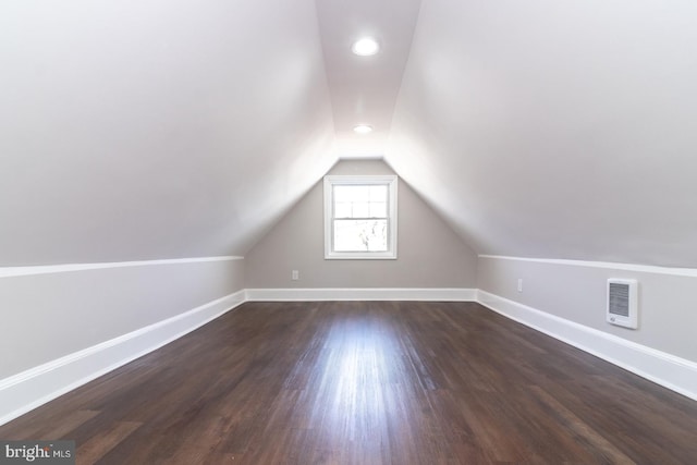 bonus room featuring vaulted ceiling, recessed lighting, baseboards, and dark wood-style flooring