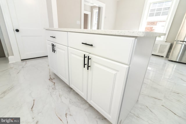 interior details with visible vents and freestanding refrigerator