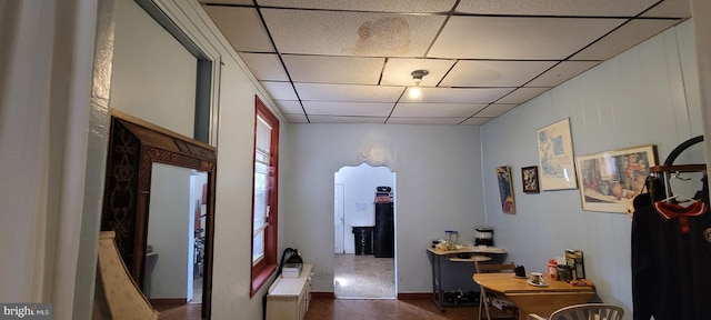 hallway with a drop ceiling