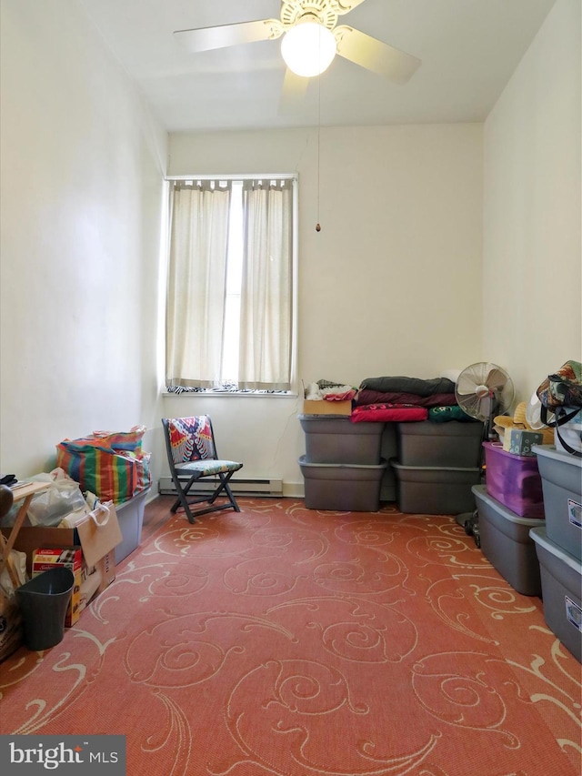 playroom featuring carpet floors, baseboard heating, and ceiling fan