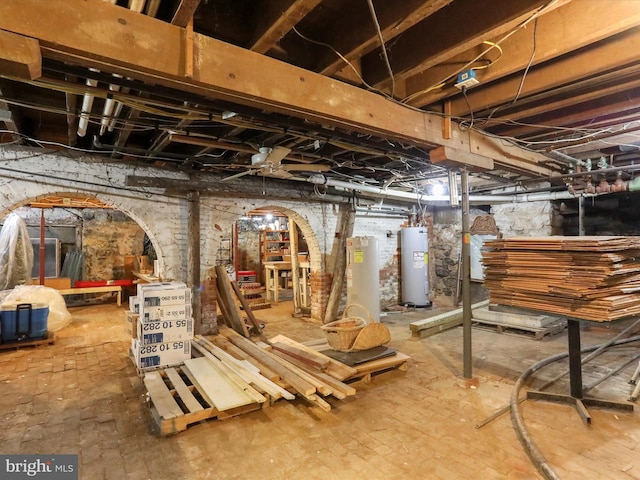 unfinished basement featuring water heater