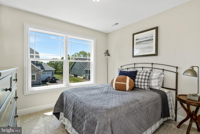 bedroom with visible vents, baseboards, and carpet flooring