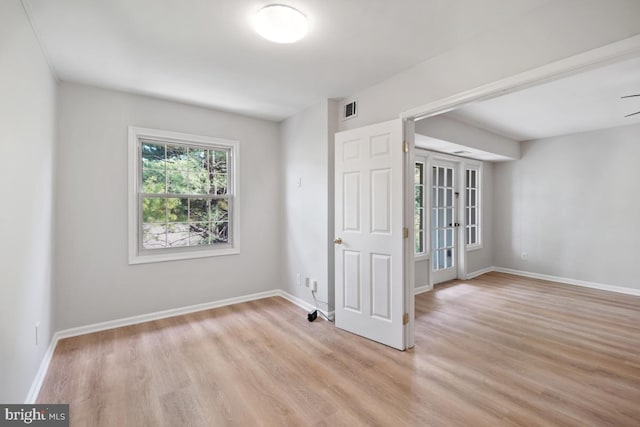 8358 Dunham Ct Unit 626, Springfield, VA 22152 - spare room featuring baseboards, visible vents, and light wood-style floors