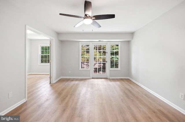 8358 Dunham Ct Unit 626, Springfield, VA 22152 - empty room featuring baseboards, a wealth of natural light, light wood-style floors, and ceiling fan