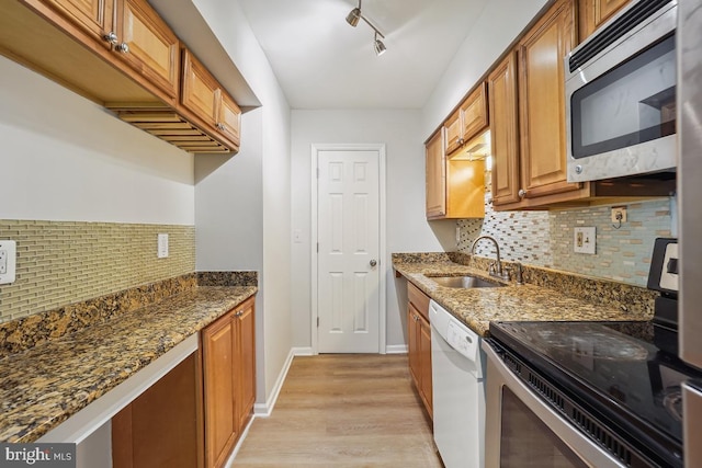 8358 Dunham Ct Unit 626, Springfield, VA 22152 - kitchen with dark stone counters, a sink, backsplash, and appliances with stainless steel finishes
