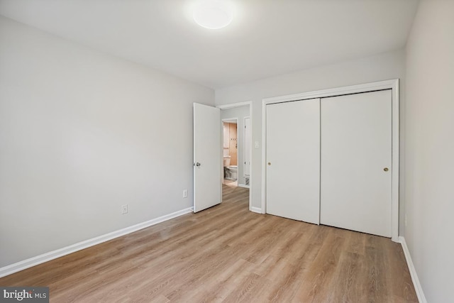 8358 Dunham Ct Unit 626, Springfield, VA 22152 - unfurnished bedroom featuring light wood finished floors, baseboards, and a closet