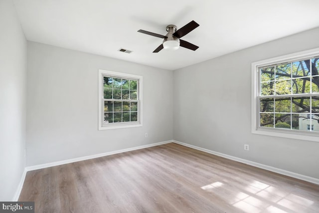 8358 Dunham Ct Unit 626, Springfield, VA 22152 - empty room featuring a wealth of natural light, a ceiling fan, and baseboards