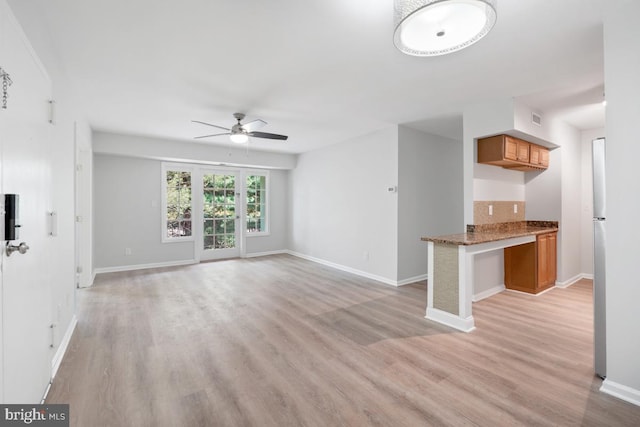 8358 Dunham Ct Unit 626, Springfield, VA 22152 - unfurnished living room with light wood finished floors, baseboards, ceiling fan, and visible vents