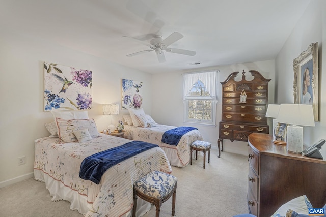 carpeted bedroom featuring a ceiling fan, baseboards, and visible vents