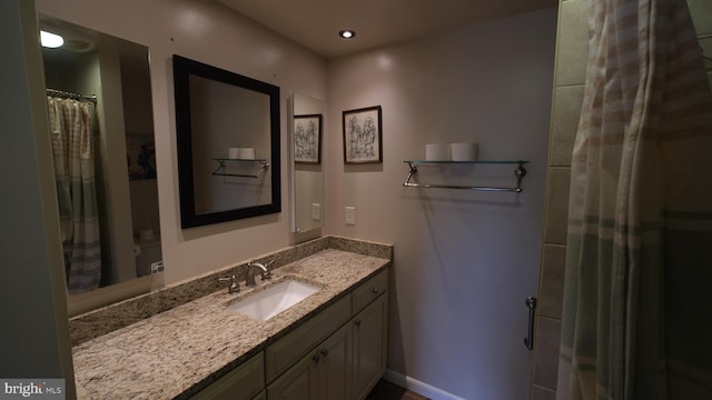 full bathroom with baseboards, recessed lighting, vanity, and a shower with curtain