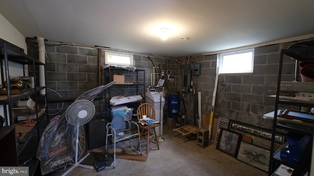 basement with washer / clothes dryer and electric panel