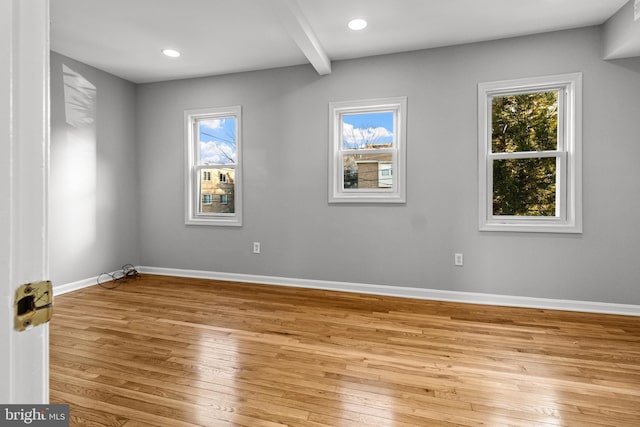 spare room with recessed lighting, light wood-style flooring, and baseboards