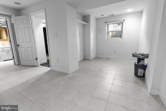 spare room with recessed lighting, light tile patterned floors, visible vents, and baseboards